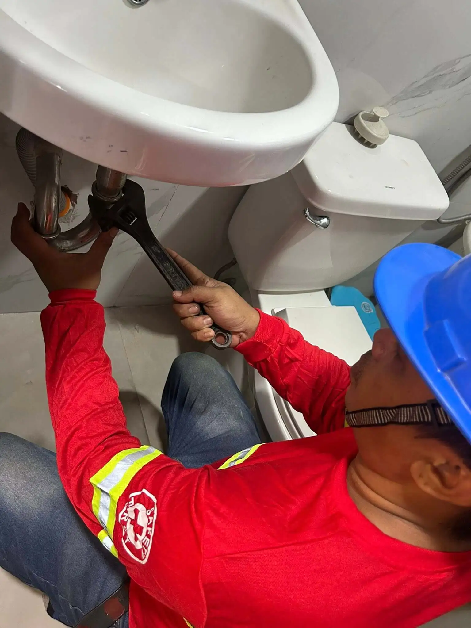 Condo technician fixing appliances